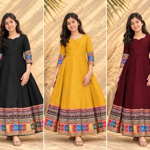 A young girl modeling a black traditional maxi dress for girls featuring vibrant ethnic printed borders.