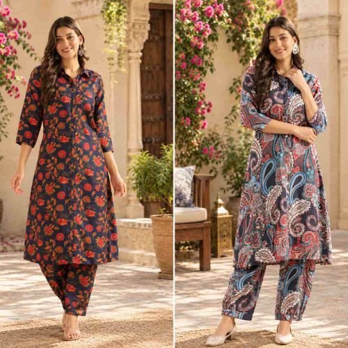 A woman wearing a printed collared kurta set with a vibrant navy, red, and light blue paisley pattern and cuffed ankle pants.